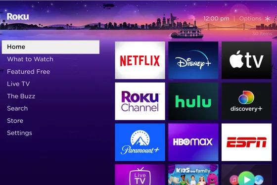 A Roku TV home screen showing streaming app tiles including Netflix, Disney+, Apple TV and Hulu